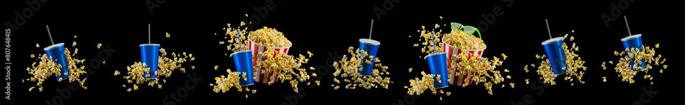Blue cup with cap and flying popcorn isolated on black background Blue cup with cap and flying popcorn isolated on black background
