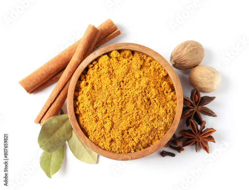 Fototapeta Naklejka Na Ścianę i Meble -  Dry curry powder in bowl and other spices isolated on white, top view