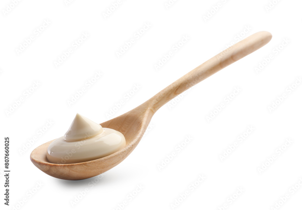 Natural yogurt in wooden spoon isolated on white Natural yogurt in wooden spoon isolated on white