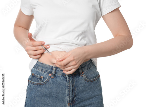 Diabetes. Woman making insulin injection into her belly on white background, closeup