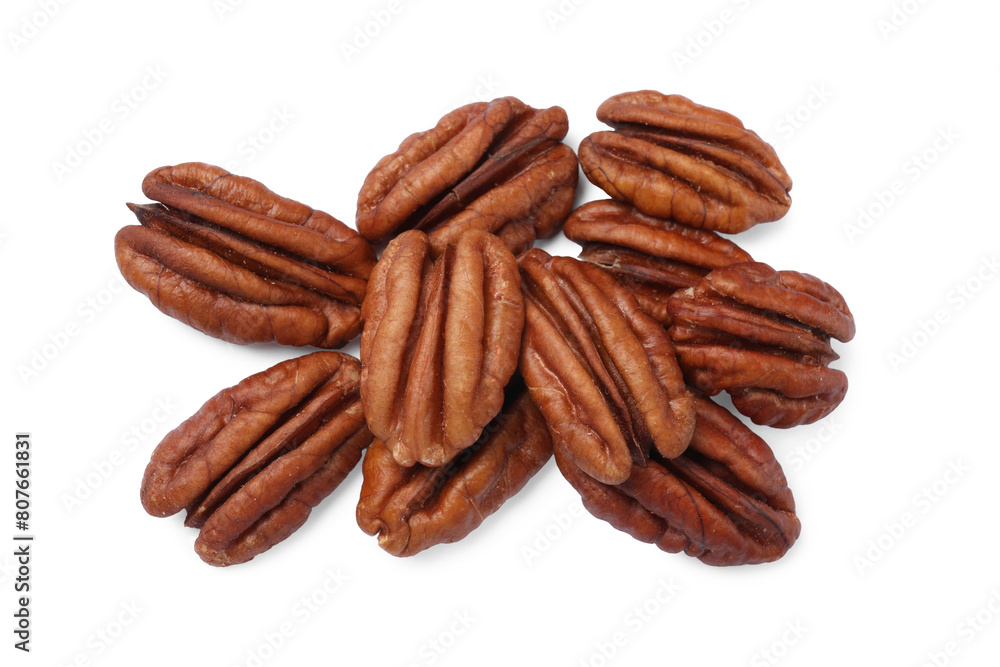 Many tasty pecan nuts isolated on white Many tasty pecan nuts isolated on white