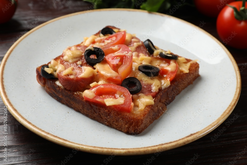 Tasty pizza toast on wooden table, closeup