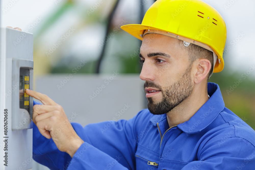 contractor entering code on outdoor keypad contractor entering code on outdoor keypad