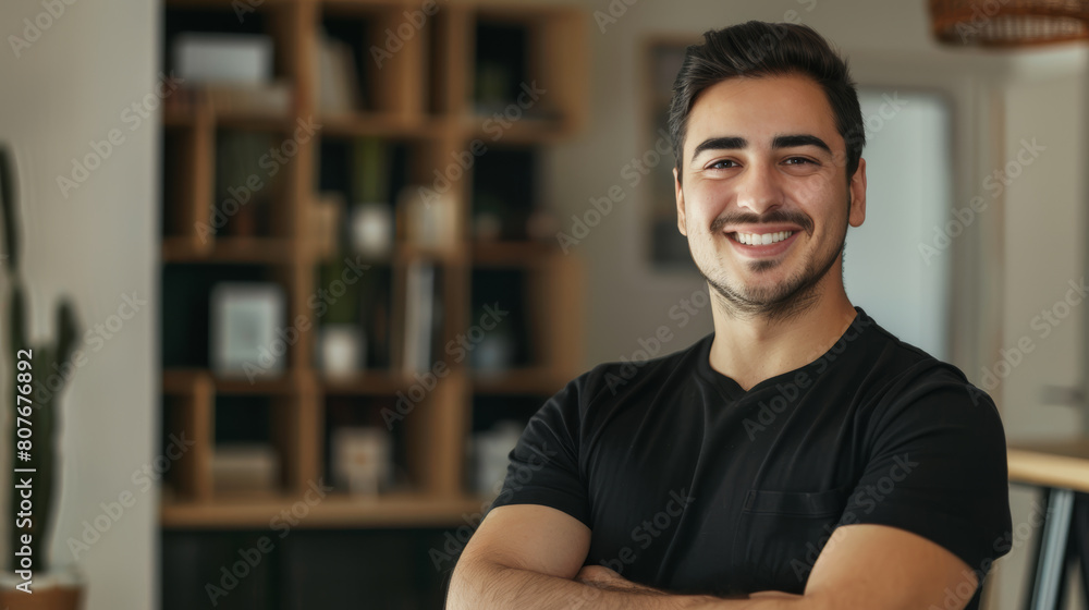Confident young man with a smile in a modern home environment. Confident young man with a smile in a modern home environment.