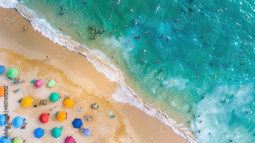 A birdseye view of a sandy beach adorned with colorful umbrellas, people enjoying the sun and water, against a backdrop of a vast blue sky AIG50