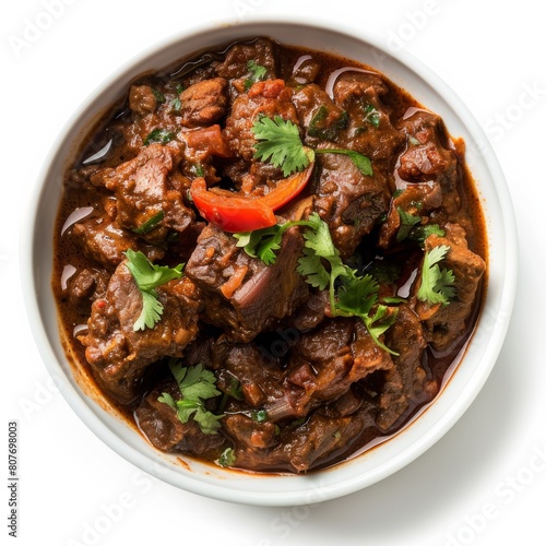 Bowl brimming with Indian Lamb Vindaloo, mixed with fresh vegetables in a creative masterpiece