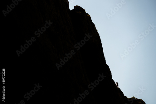 Silhouette of a climber on a steep rock. Mount Anica Kuk, Paklenica National Park, Croatia. photo