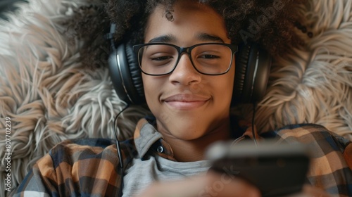 Boy Relaxing with Headphones at Home photo
