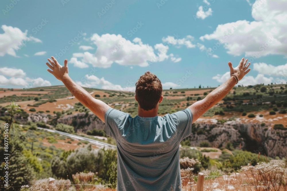 Man Celebrating on Mountain Top with Arms Raised, Victory, Freedom, Outdoor Adventure Man Celebrating on Mountain Top with Arms Raised, Victory, Freedom, Outdoor Adventure