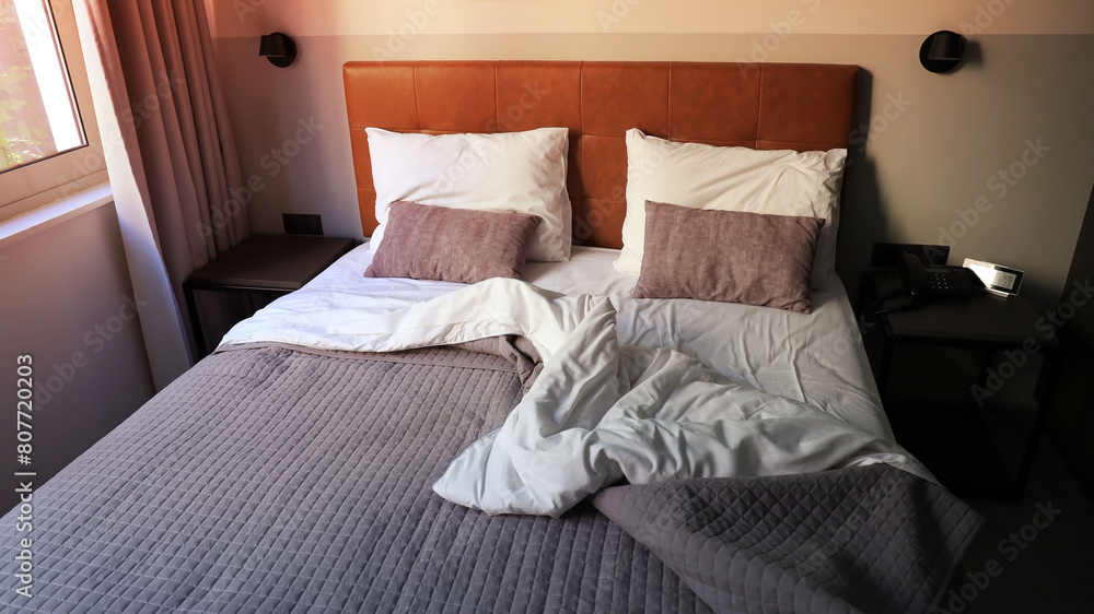 white pillows on the bedroom on a bed with duvet case bedspread isolated on white background