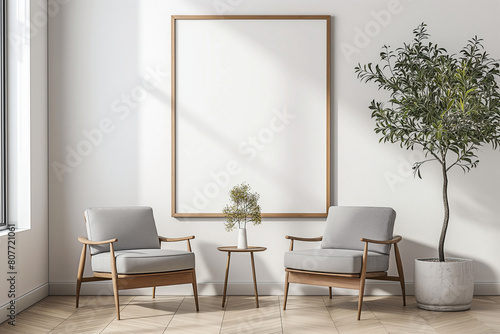 Two Armchairs in a Room with a White Wall and a Large Frame