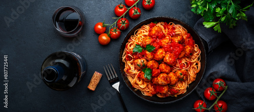 Italian spaghetti in bolognese sauce with meatballs, black table background, top view © 5ph