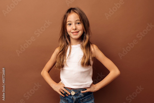 Smiling kid girl in casual outfit