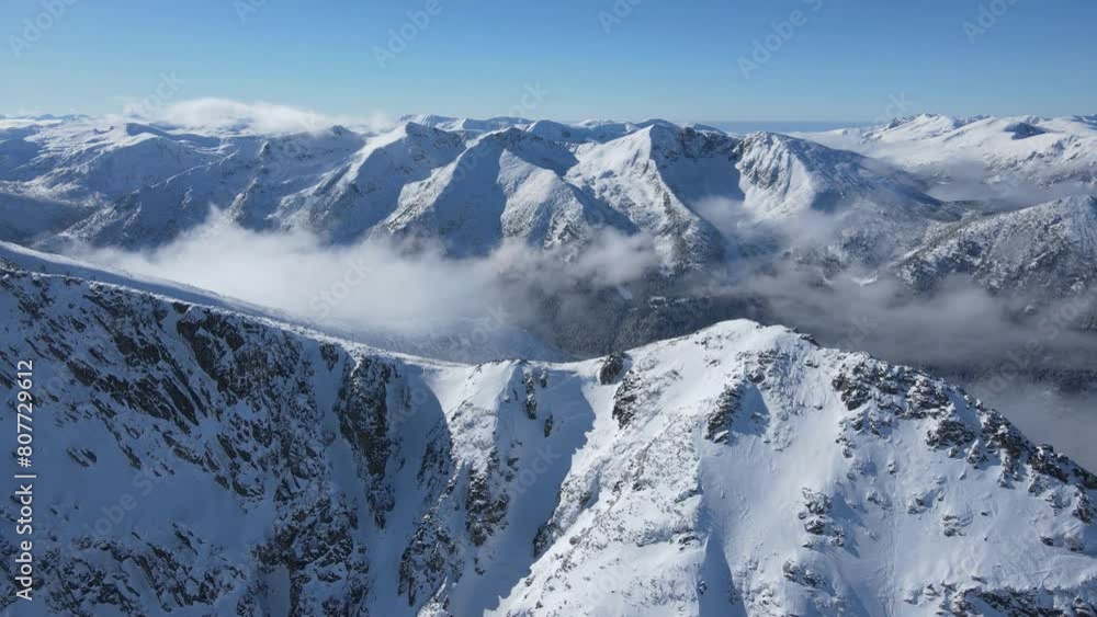 Amazing Aerial Winter view of Rila mountain near Musala peak, Bulgaria Amazing Aerial Winter view of Rila mountain near Musala peak, Bulgaria