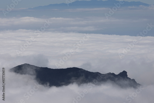 clouds over mountain © jontcphoto