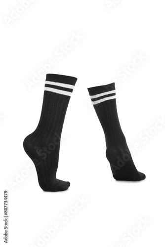 Subject shot of black shadow-proof socks with two white stripes on the rim. The photo is made on the white background. Side view.