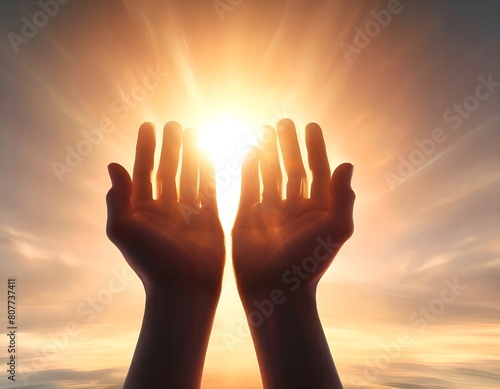 The palms of the hands reach out to the rays of the rising sun