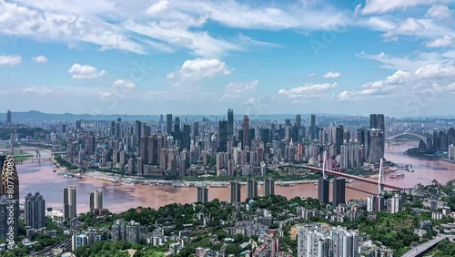 The Panoramic View Of Blue Sky Clouds Passing Over Midtown Commercial Residential Towers And Modern Skyscrapers Skyline Buildings Metropolis Scene City With Traffic photo