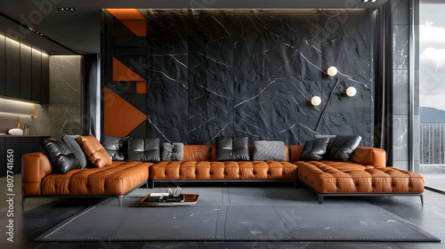 Modern interior design of the living room in dark gray and orange tones, leather sofa with armrests for seating, black stone wall panels photo