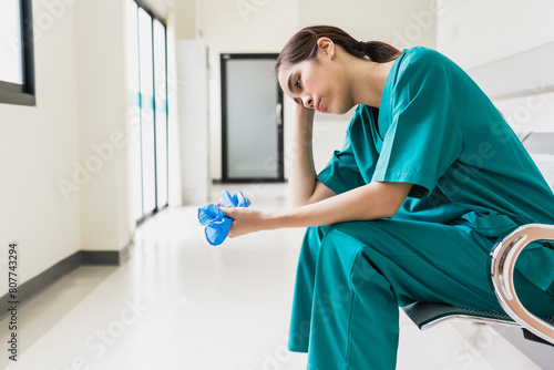 Obraz na plátně Asian female nurse feeling depress with hospital work