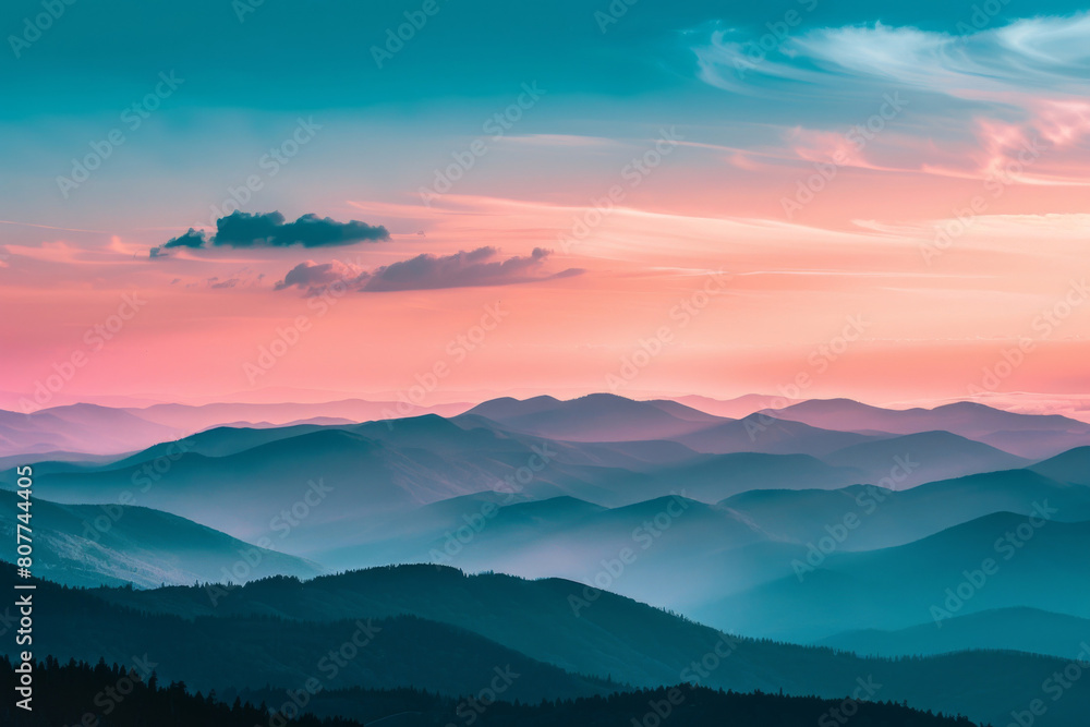 Serene landscape showcasing the breathtaking view of layered mountain ridges under a vivid sunset sky with soft clouds