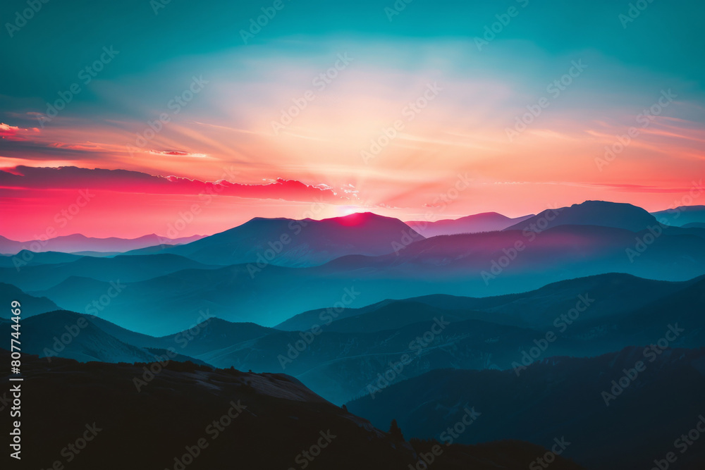 Tranquil and majestic mountain sunset casting vibrant orange, pink, blue, and golden colors over the ethereal wilderness landscape