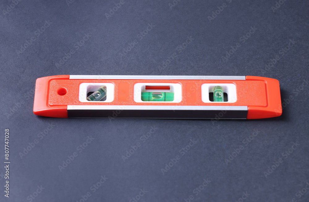 Building level on dark background. Construction tool Building level on dark background. Construction tool