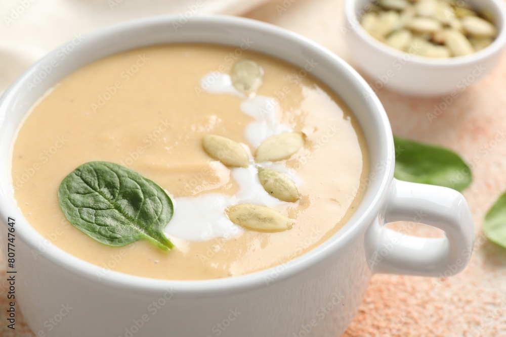 Healthy cream soup high in vegetable fats on color textured table, closeup Healthy cream soup high in vegetable fats on color textured table, closeup