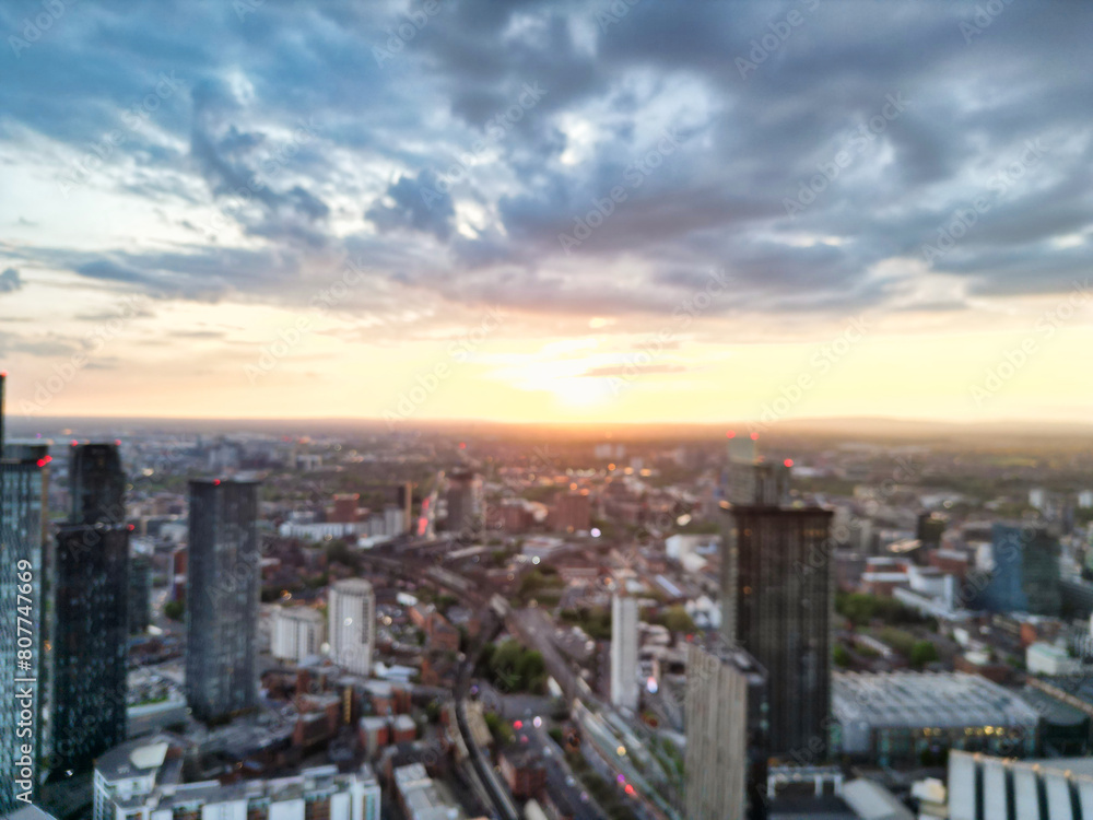 Fototapeta premium Aerial View of Great Manchester City Centre and Tall Buildings During Golden Hour of Sunset. May 5th, 2024