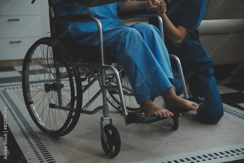 Obraz premium Doctor giving hope. Close up shot of young female physician leaning forward to smiling elderly lady patient holding her hand in palms. Woman caretaker in white coat supporting encouraging old person