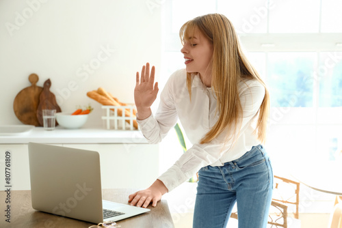 Teenage girl with laptop vi...