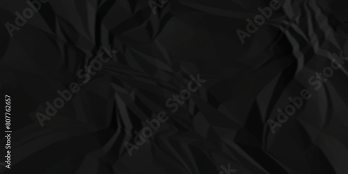 Dark black crumpled paper texture background. black crumpled and top view textures can be used for background of text or any contents.	