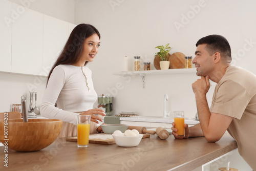 Happy young couple cooking ...