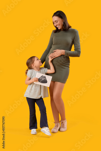 Pregnant mother with little...