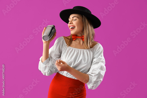 Female bartender with shake...
