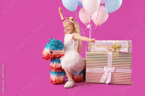 Cute little girl with pinat...