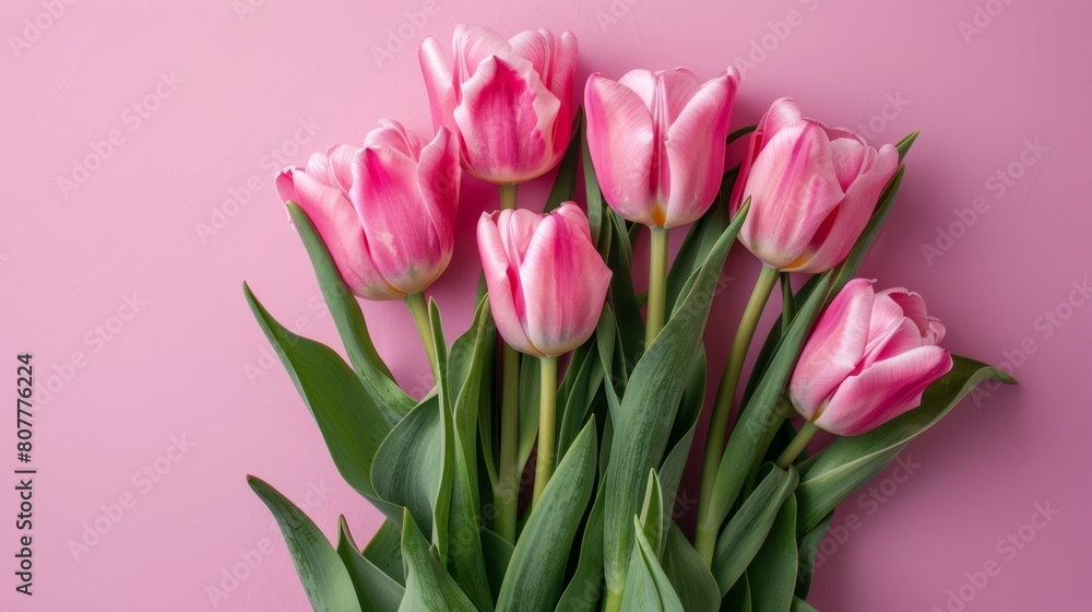 Beautiful composition flowers. Bouquet of pink tulips flowers on pastel pink background. Flat lay, top view, no hands Beautiful composition flowers. Bouquet of pink tulips flowers on pastel pink background. Flat lay, top view, no hands