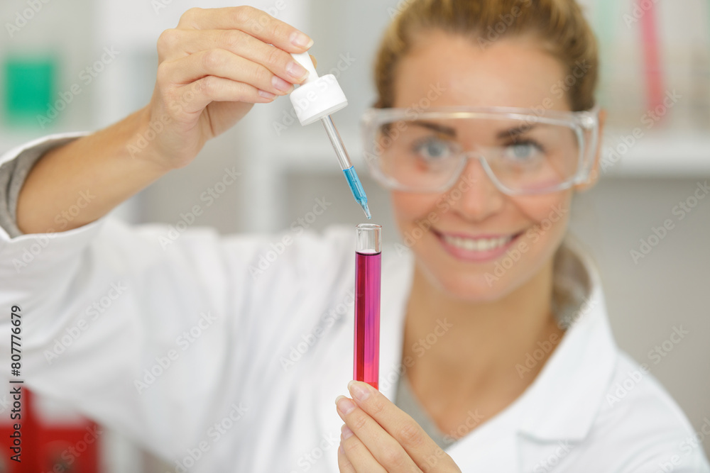 young girl in the laboratory doing experiments young girl in the laboratory doing experiments