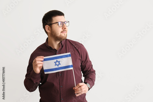 Young Jewish man with flag ...