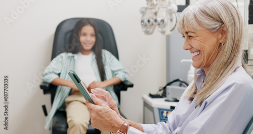 Tablet, doctor and smile for video call, clinic and patient in office for eye care, kid and specialist. Communication, online and visual healthcare, information and optician with child and exam