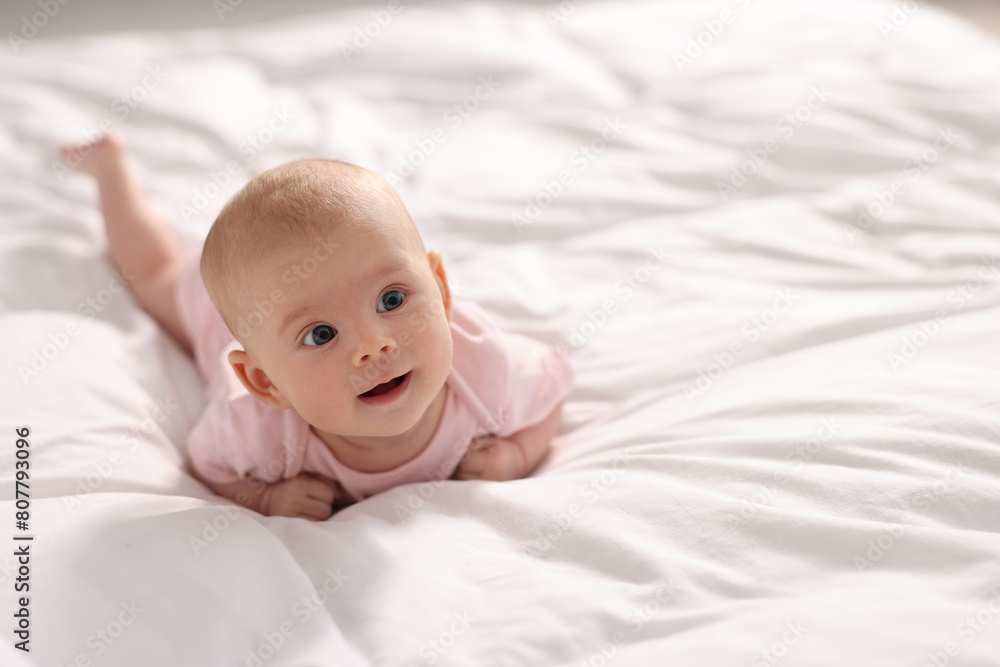 Cute little baby lying on white sheets, space for text Cute little baby lying on white sheets, space for text