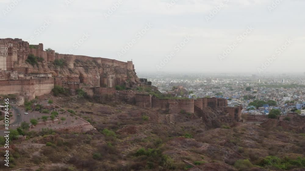 ancient historical fort with blue city view and dramatic sunset sky video is taken at mehrangarh fort jodhpur rajasthan india. ancient historical fort with blue city view and dramatic sunset sky video is taken at mehrangarh fort jodhpur rajasthan india.