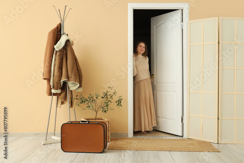 Young woman walking through...