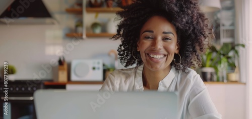 Smiling Woman with Curly Hair Working from Home.