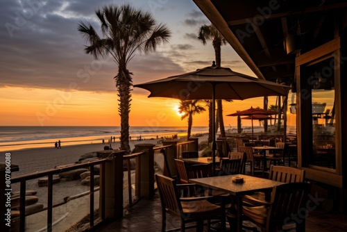 A Cozy Seaside Cafe at Dusk with Vibrant Umbrellas and a Stunning View of the Setting Sun