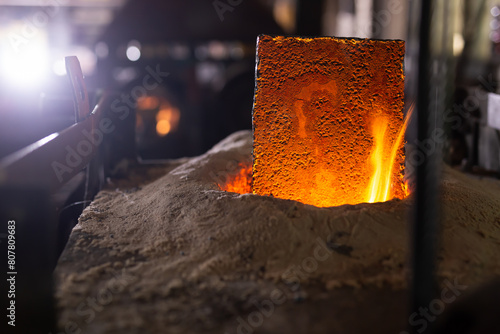 Foundry - ferrous metal is melted in an induction furnace of metallurgical plant photo