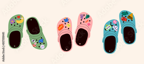 Set of crocs with embellishments. Unisex slates. Trendy vector illustration. photo
