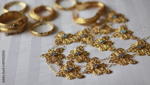 Obraz na plátně Gold colored jewelry accessories to build an image of luxury and beautify appearance