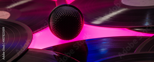 background with vinyl records and microphone © serhii