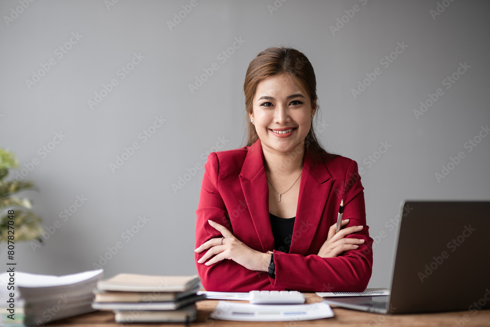 Portrait of a confident Asian business woman Working in a modern office desk using a laptop computer marketing concept Portrait of a confident Asian business woman Working in a modern office desk using a laptop computer marketing concept